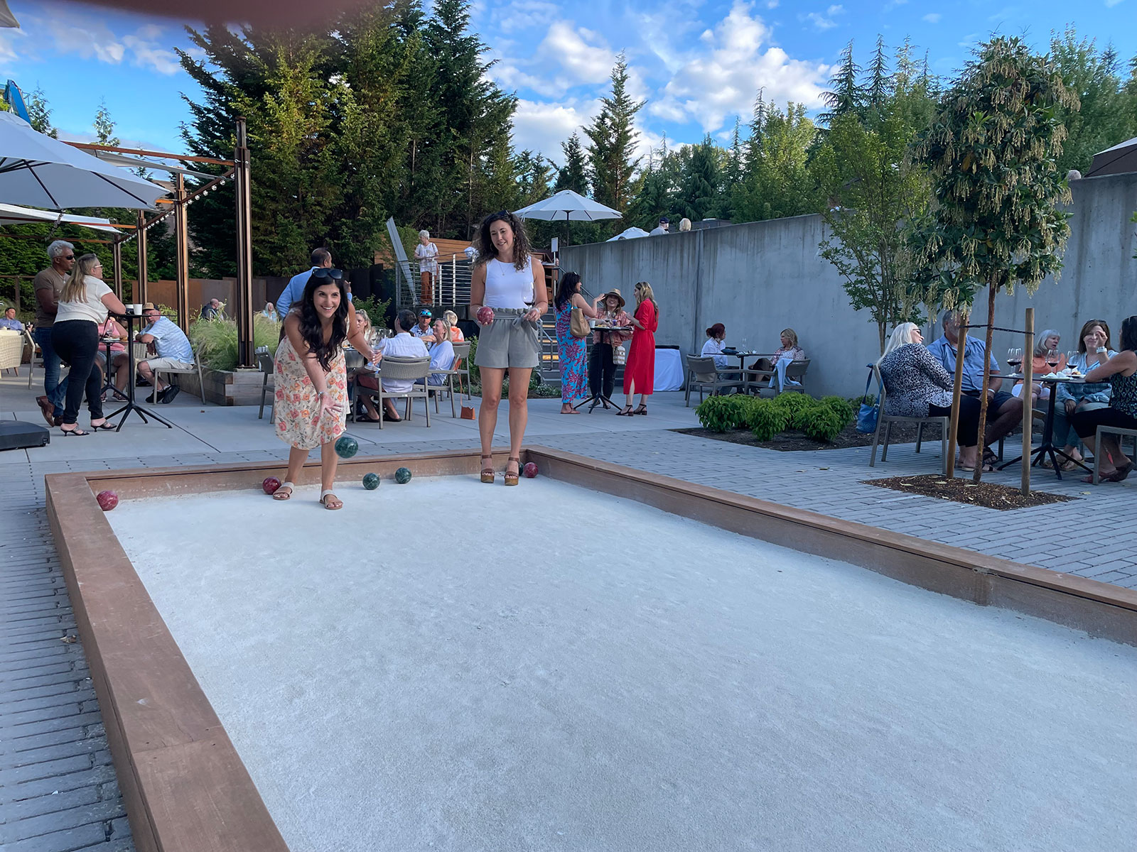 Bocce ball and wine tasting on outdoor patio at Novelty Hill Januik wine club event in Woodinville