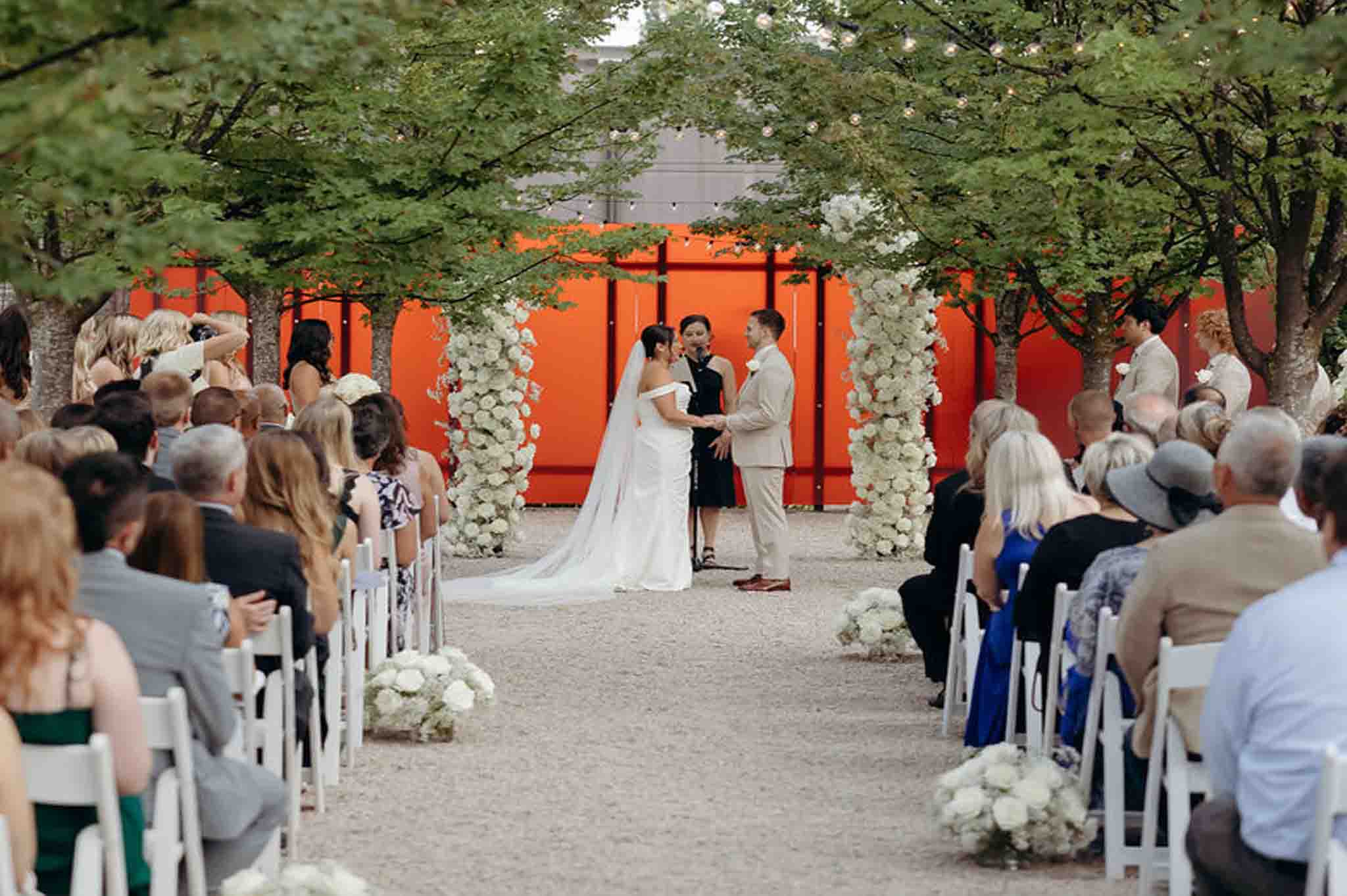 An outdoor garden wedding ceremony .