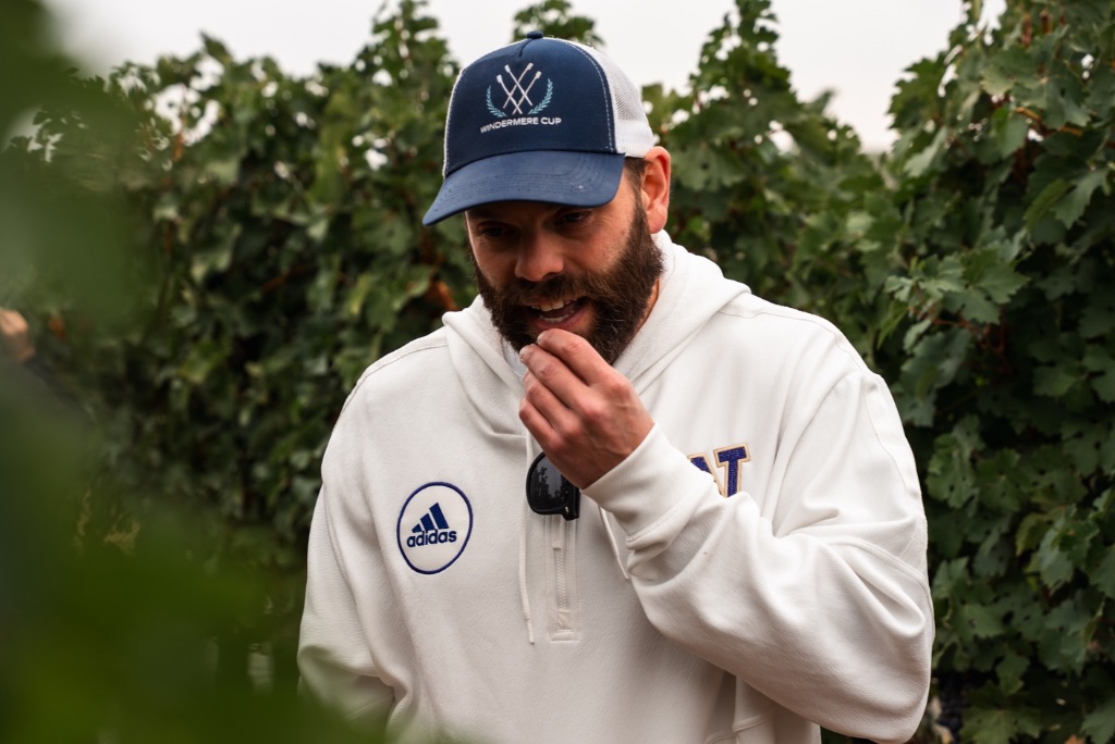 Winemaker Tasting Winemaker Andrew Januik tasting grapes in a Washington vineyard to determine when to harvest wine grapes for optimal ripeness.